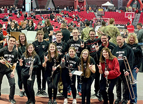 NIU Pep Band alumni members post for photo