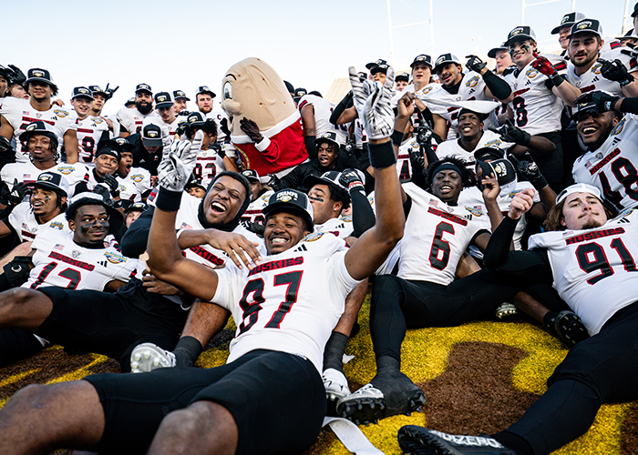 football-page-with-huskie-alumni