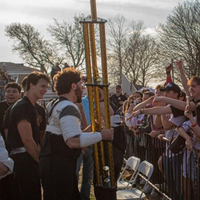 Men's TUGS participants holding trophy and celebrating