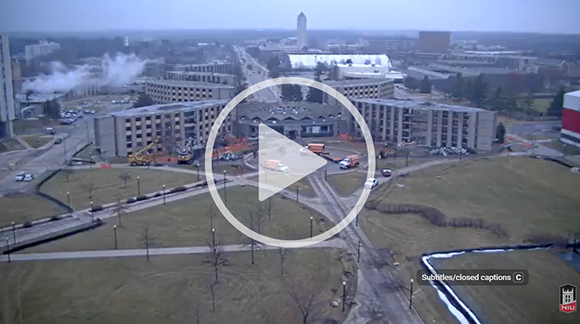 Video screen shot of the demolition of Douglas Hall on the DeKalb campus of NIU