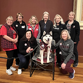 Small group of nine Golden Huskies at the reunion reception in 2025.