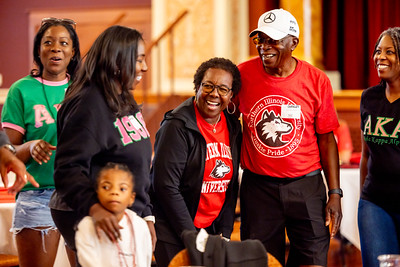 Family laughing at an NIU Event
