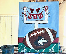 Painting option: Football with NIU Huskie logo in front of goal posts with NIU banner