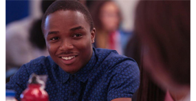 Image of a student smiling while talking